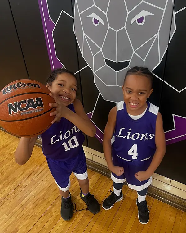 boys in basketball uniform